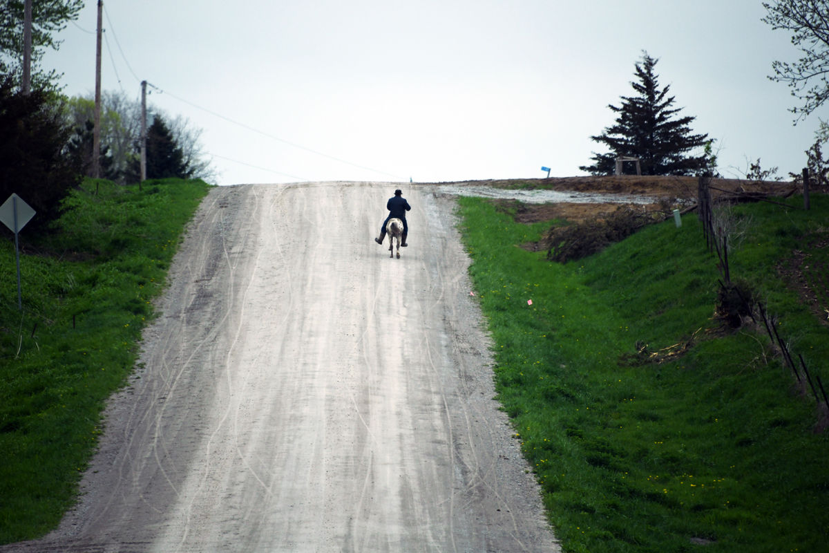 112 Amish man rides horseback in Kalona countryside.JPG